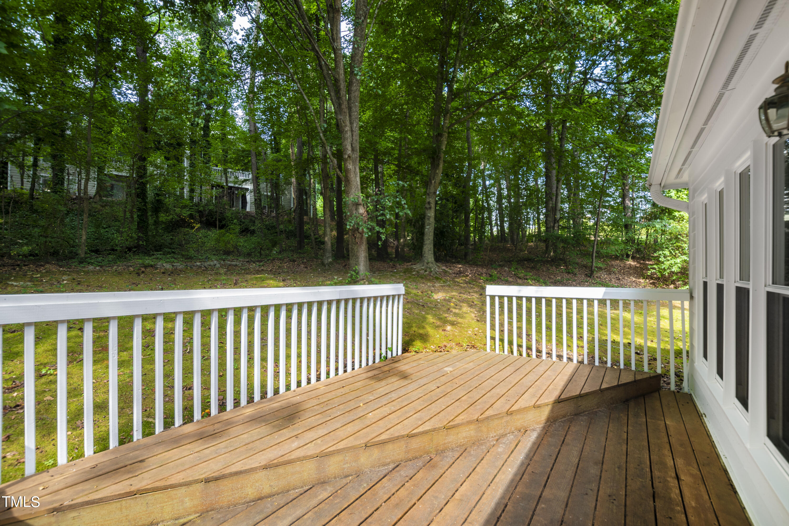 3834 Carnegie Lane Raleigh, NC 27612 - Photo 35 of 38 a view of deck with wooden floor and fence