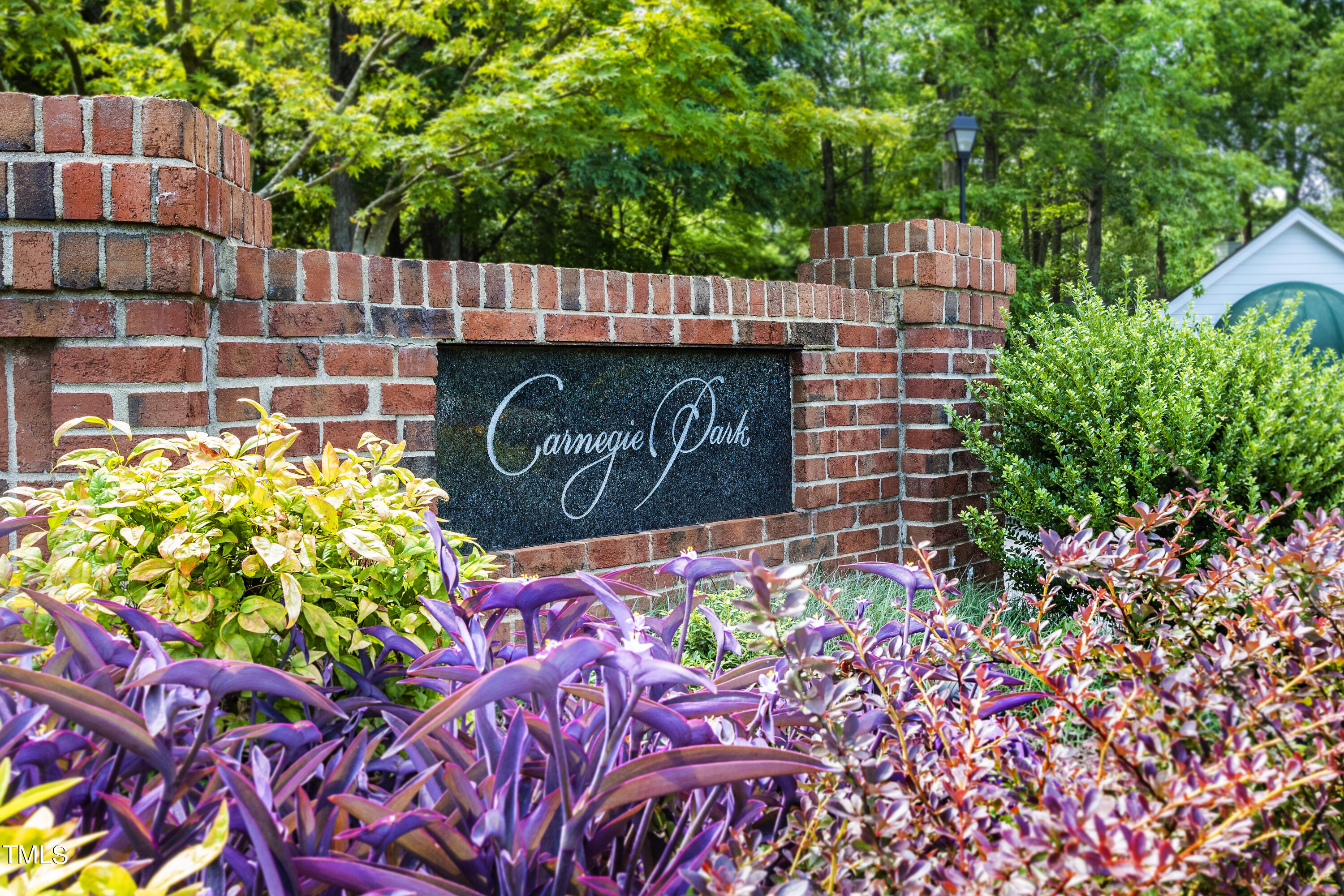 3834 Carnegie Lane Raleigh, NC 27612 - Photo 37 of 38 a sign on the side of a building
