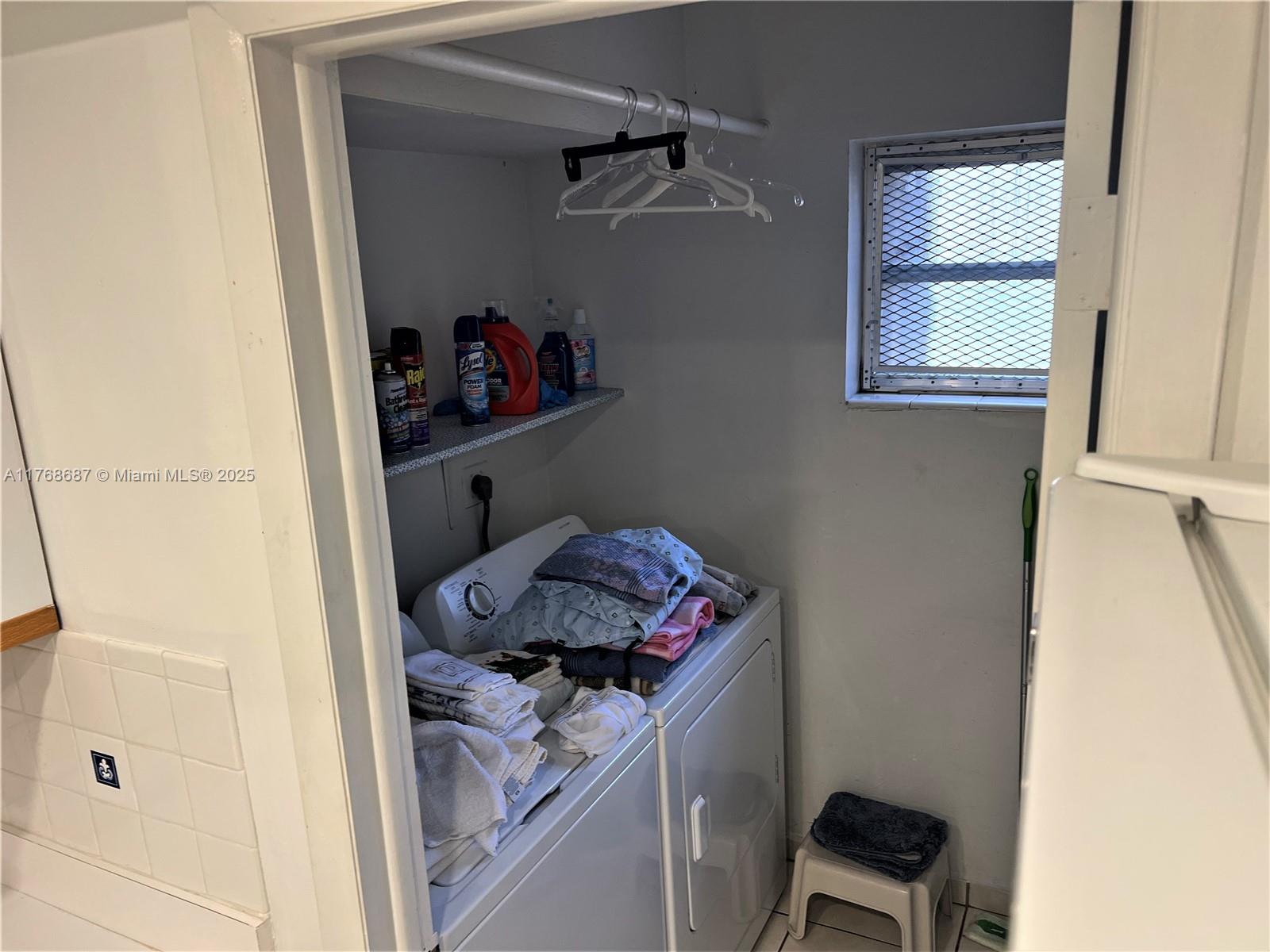 8401 Southwest 107th Avenue, Unit 121E Miami, FL 33173 - Photo 12 of 19 a view of storage and utility room with a window