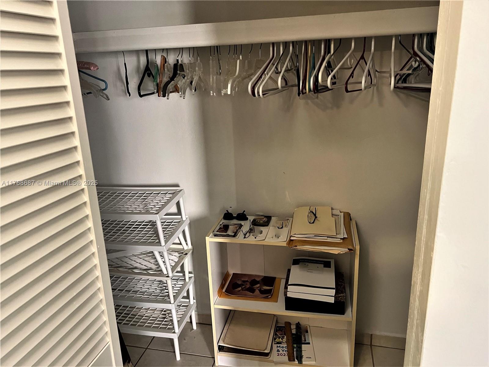 8401 Southwest 107th Avenue, Unit 121E Miami, FL 33173 - Photo 13 of 19 a room with storage and utility