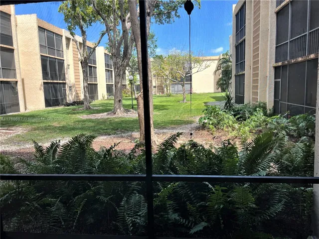 a view of a house with backyard from deck