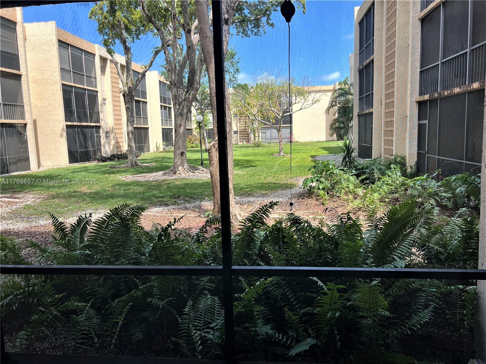 8401 Southwest 107th Avenue, Unit 121E Miami, FL 33173 - Photo 14 of 19 a view of a house with backyard from deck
