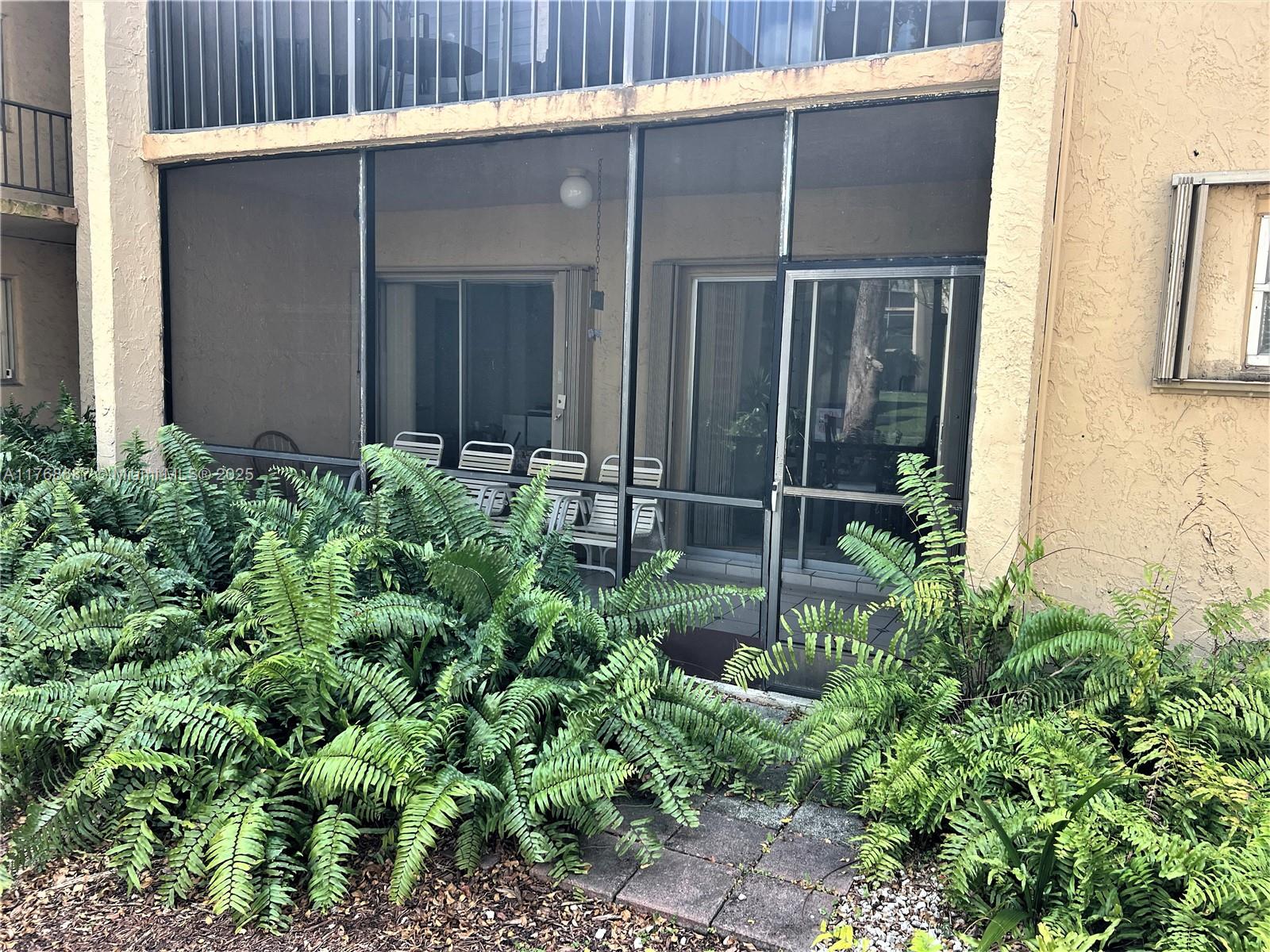 8401 Southwest 107th Avenue, Unit 121E Miami, FL 33173 - Photo 15 of 19 a garden view with outdoor space