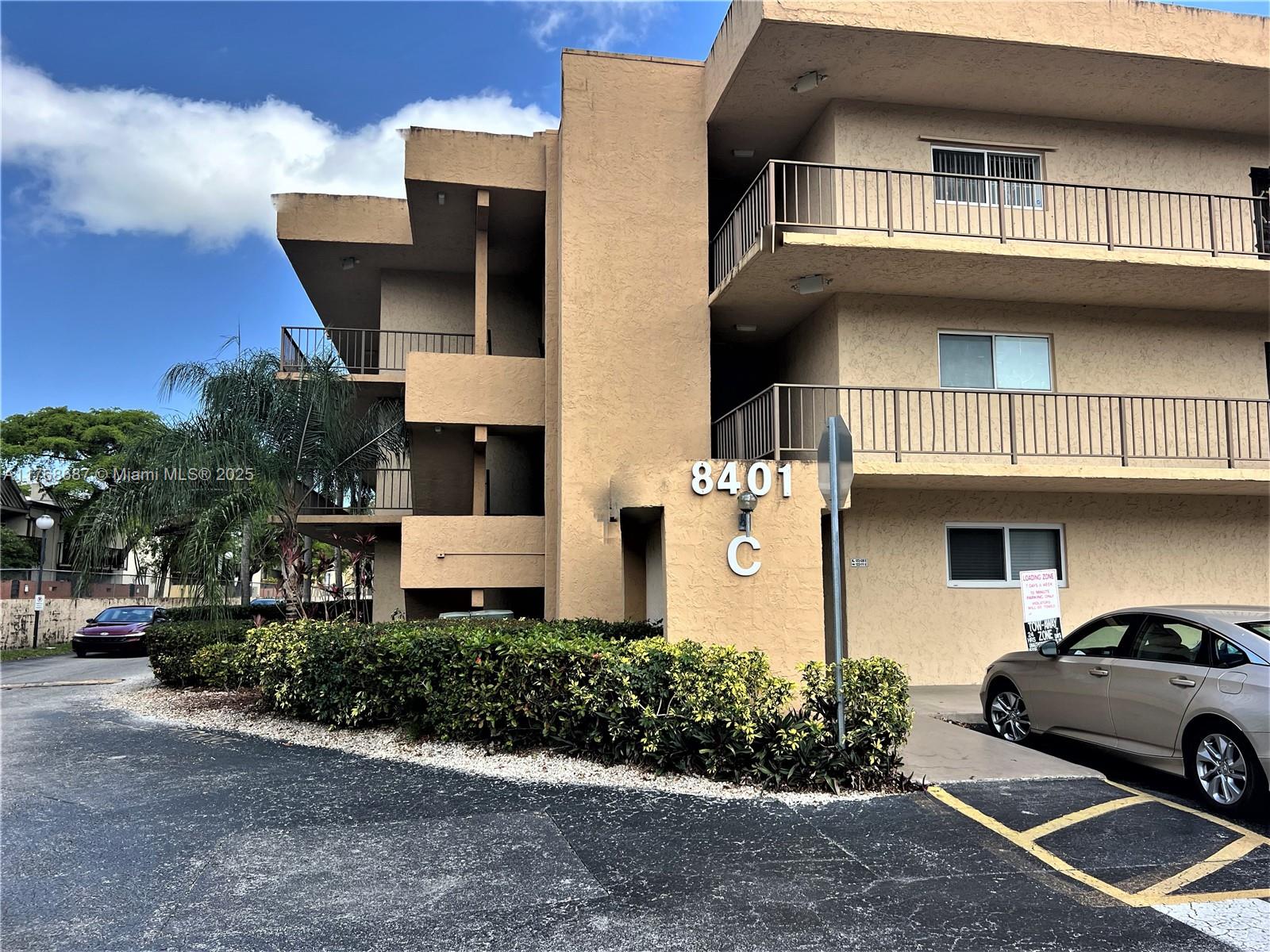 8401 Southwest 107th Avenue, Unit 121E Miami, FL 33173 - Photo 17 of 19 a front view of a house with yard