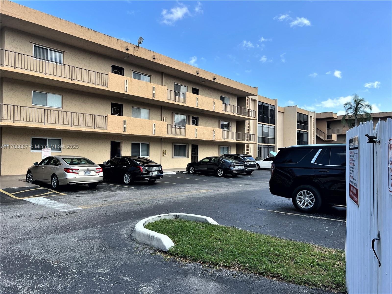 8401 Southwest 107th Avenue, Unit 121E Miami, FL 33173 - Photo 4 of 19 a car parked in front of a building