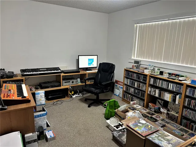 a room with furniture and gym equipment