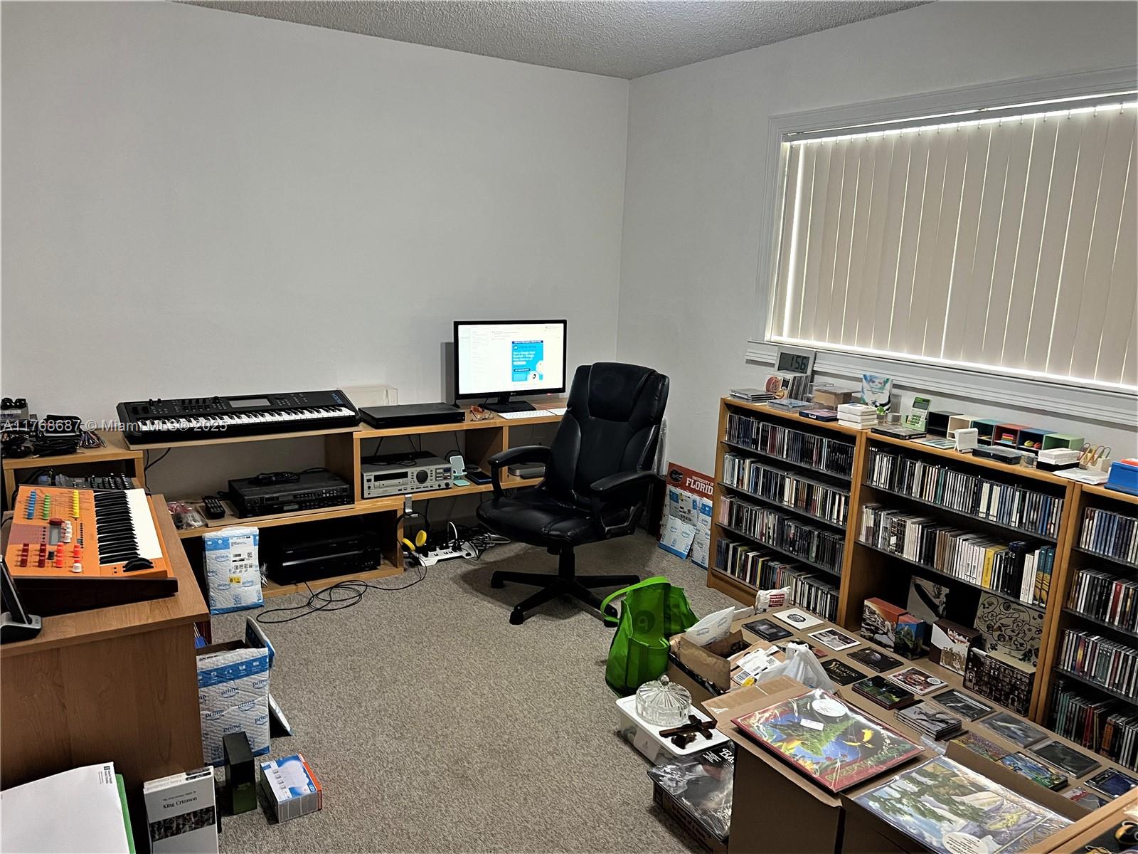 8401 Southwest 107th Avenue, Unit 121E Miami, FL 33173 - Photo 6 of 19 a room with furniture and gym equipment