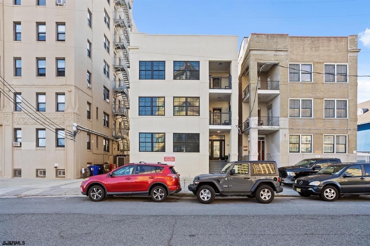 a car parked in front of a buildings