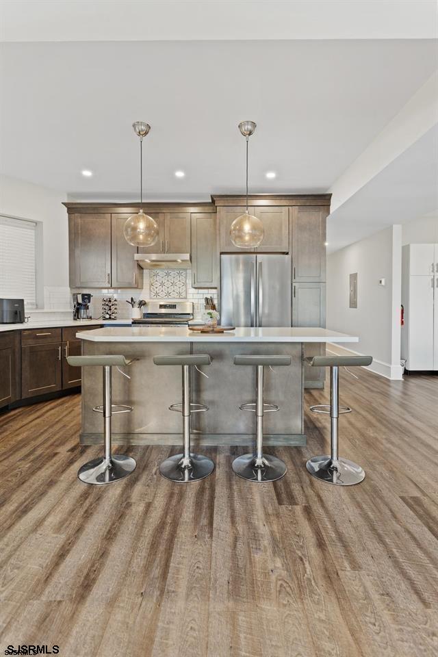 114 South Raleigh Avenue Atlantic City, NJ 08401 - Photo 11 of 52 a kitchen with a sink a stove a refrigerator and cabinets