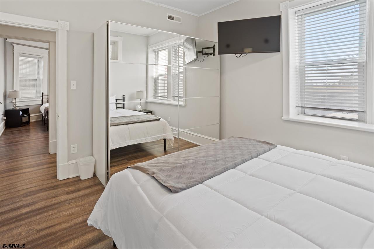 114 South Raleigh Avenue Atlantic City, NJ 08401 - Photo 16 of 52 a bedroom with a bed and a flat screen tv