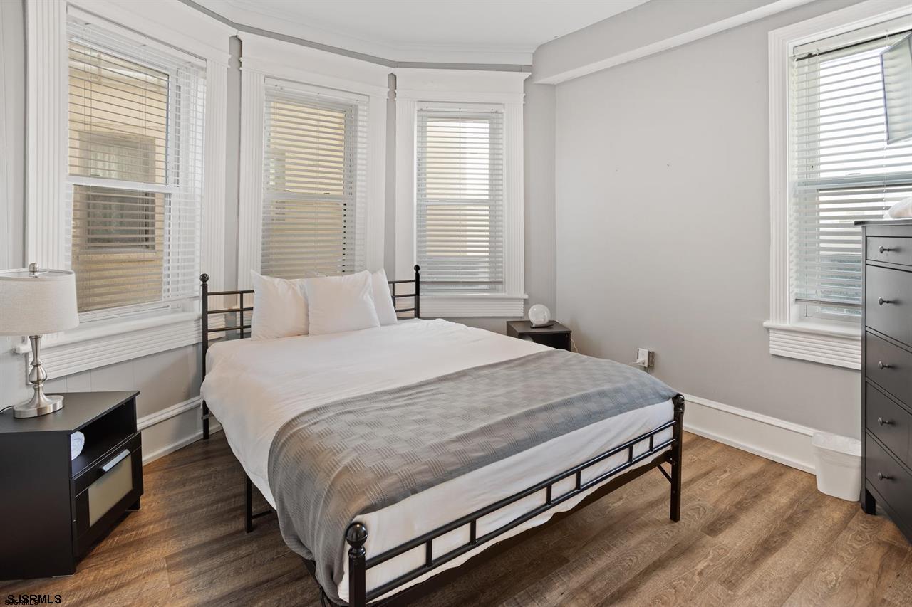 114 South Raleigh Avenue Atlantic City, NJ 08401 - Photo 19 of 52 a bed sitting in a bedroom next to a window