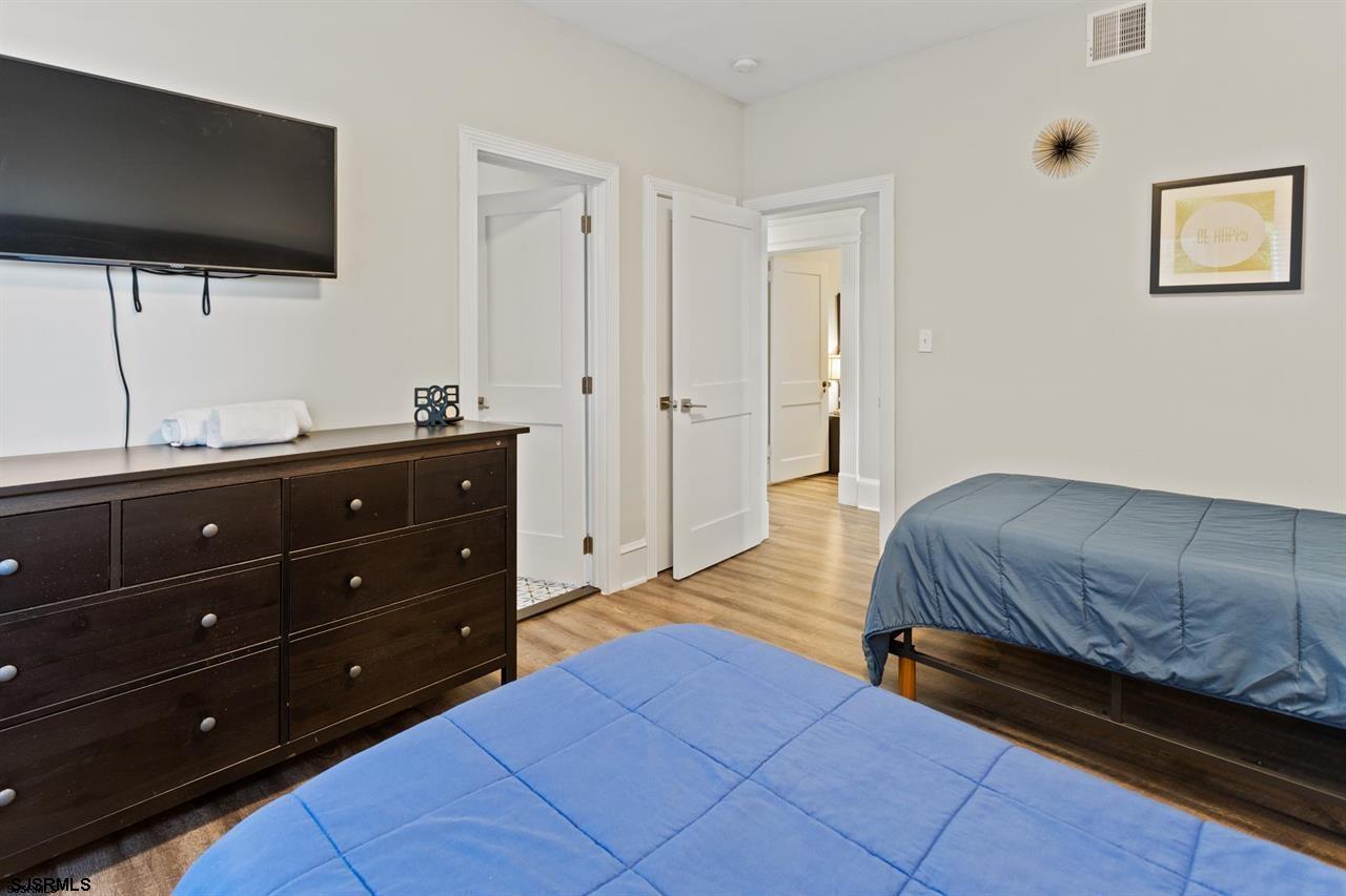 114 South Raleigh Avenue Atlantic City, NJ 08401 - Photo 25 of 52 a bedroom with a bed and a flat screen tv