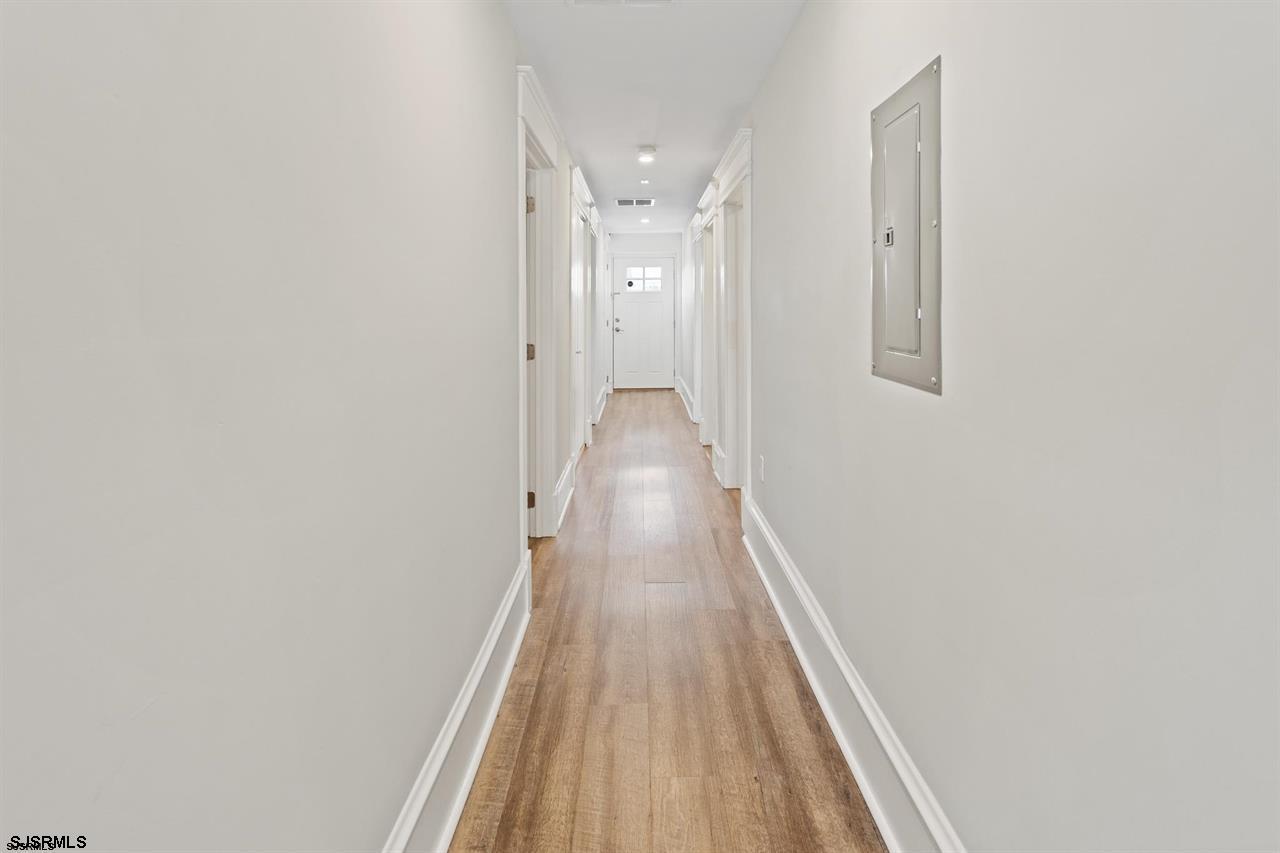 114 South Raleigh Avenue Atlantic City, NJ 08401 - Photo 30 of 52 a view of a hallway with wooden floor