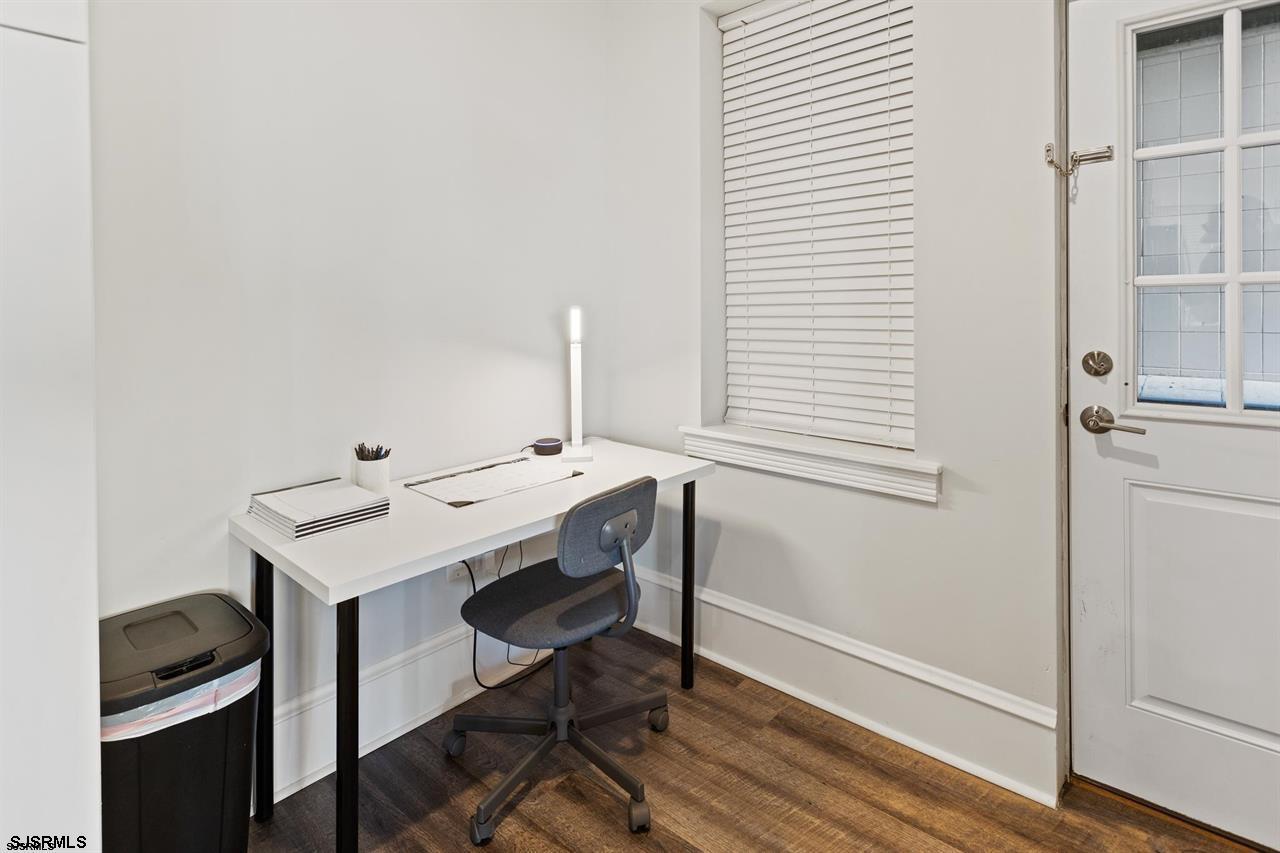 114 South Raleigh Avenue Atlantic City, NJ 08401 - Photo 32 of 52 a view of a workspace with furniture and wooden floor