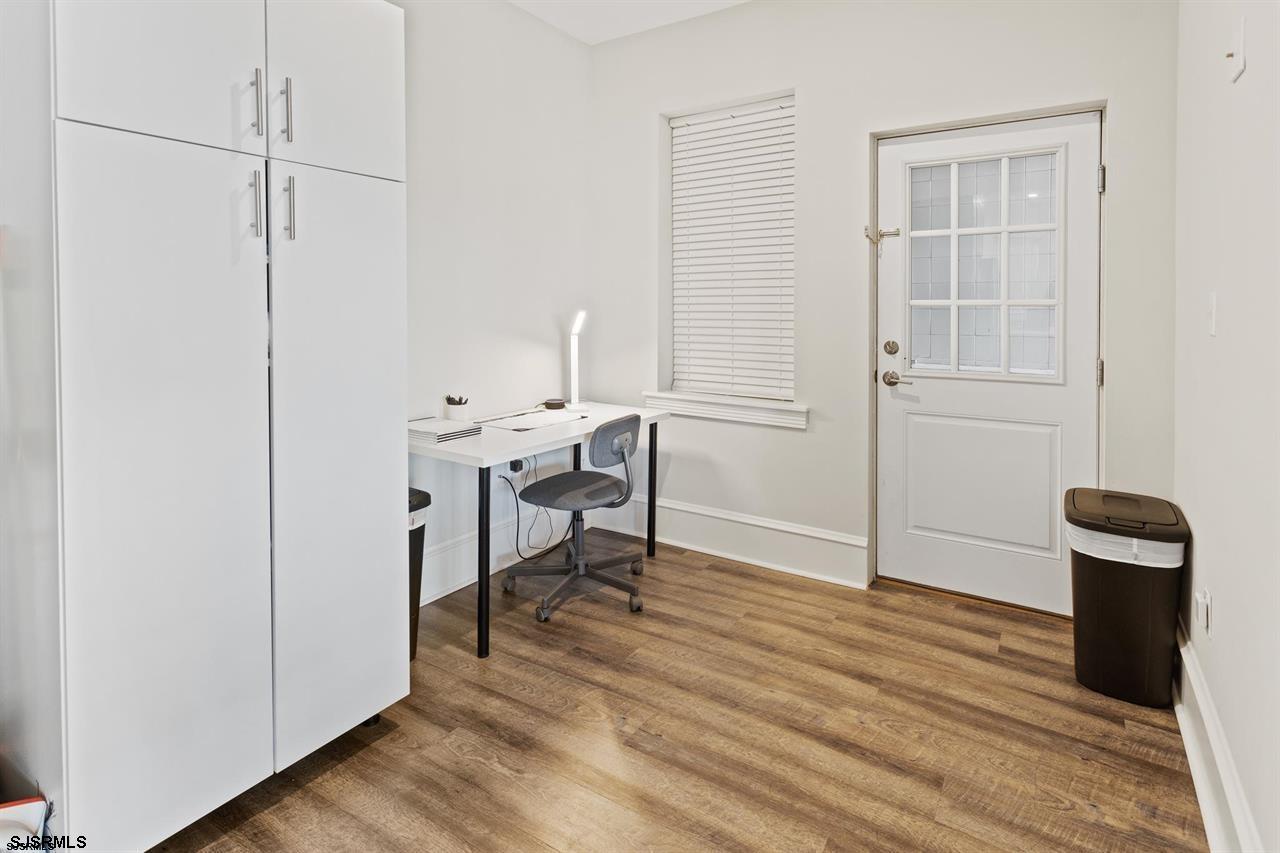 114 South Raleigh Avenue Atlantic City, NJ 08401 - Photo 33 of 52 a view of a room with wooden floor cabinet and windows