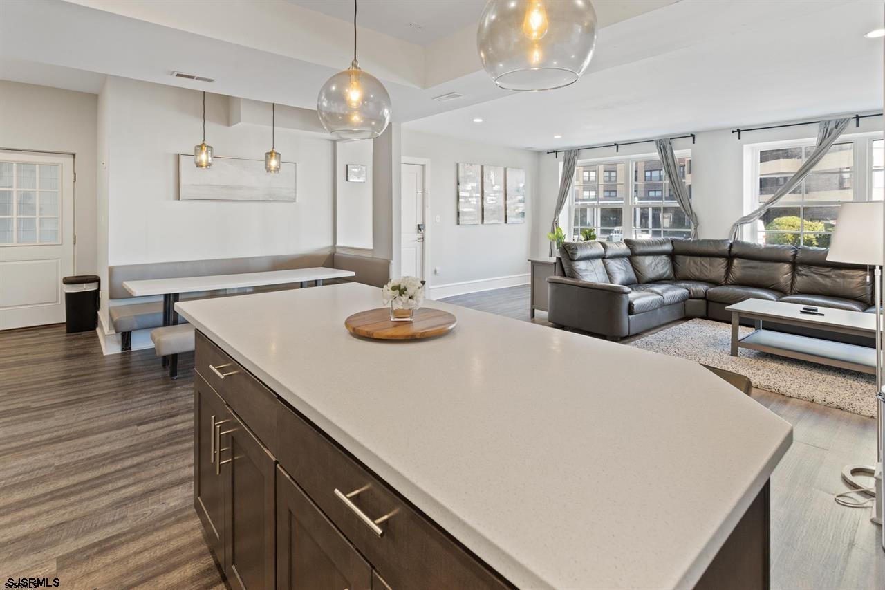 114 South Raleigh Avenue Atlantic City, NJ 08401 - Photo 34 of 52 a kitchen with a table chairs and wooden floor