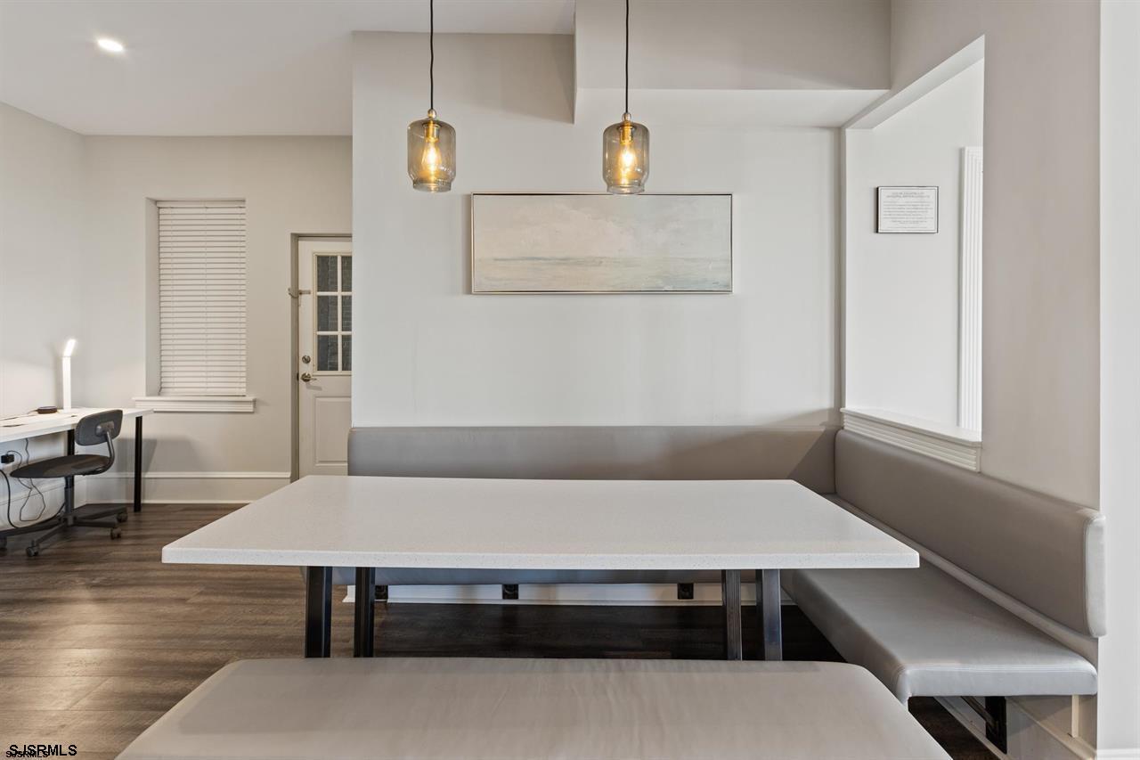 114 South Raleigh Avenue Atlantic City, NJ 08401 - Photo 37 of 52 a living room with a table chairs and wooden floor
