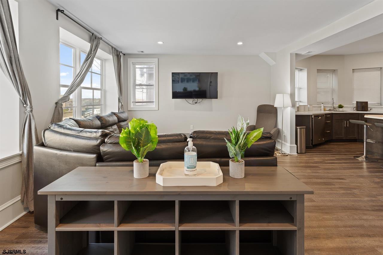 114 South Raleigh Avenue Atlantic City, NJ 08401 - Photo 41 of 52 a dining room with wooden floor and large windows