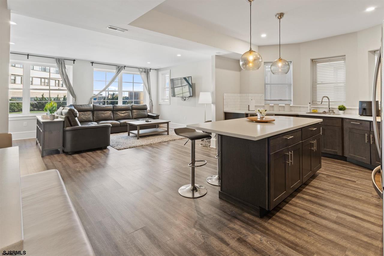 114 South Raleigh Avenue Atlantic City, NJ 08401 - Photo 7 of 52 a kitchen with a sink stove and wooden floor