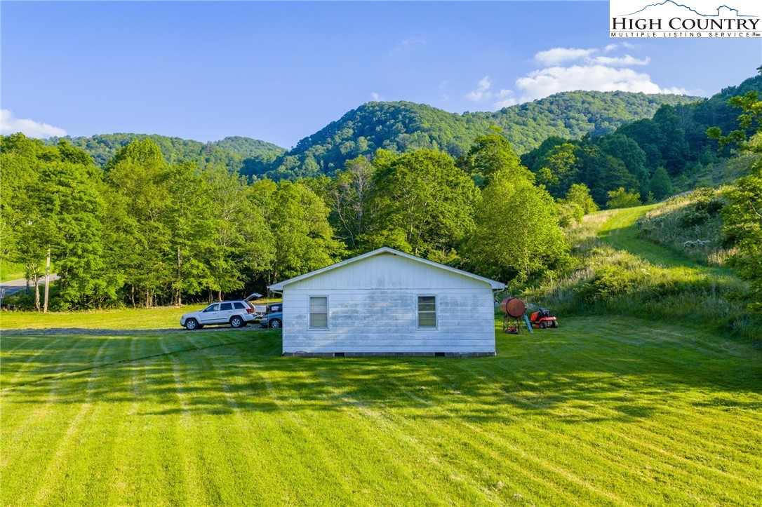 4690 3 Top Road Todd, NC 28684 - Photo 11 of 49 a view of a house with a yard