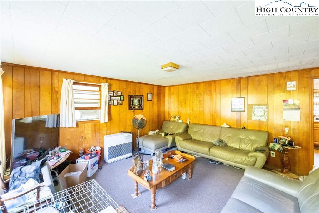 4690 3 Top Road Todd, NC 28684 - Photo 21 of 49 a living room with furniture and floor to ceiling windows