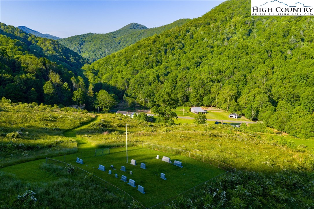4690 3 Top Road Todd, NC 28684 - Photo 28 of 49 a backyard of a house with lots of green space