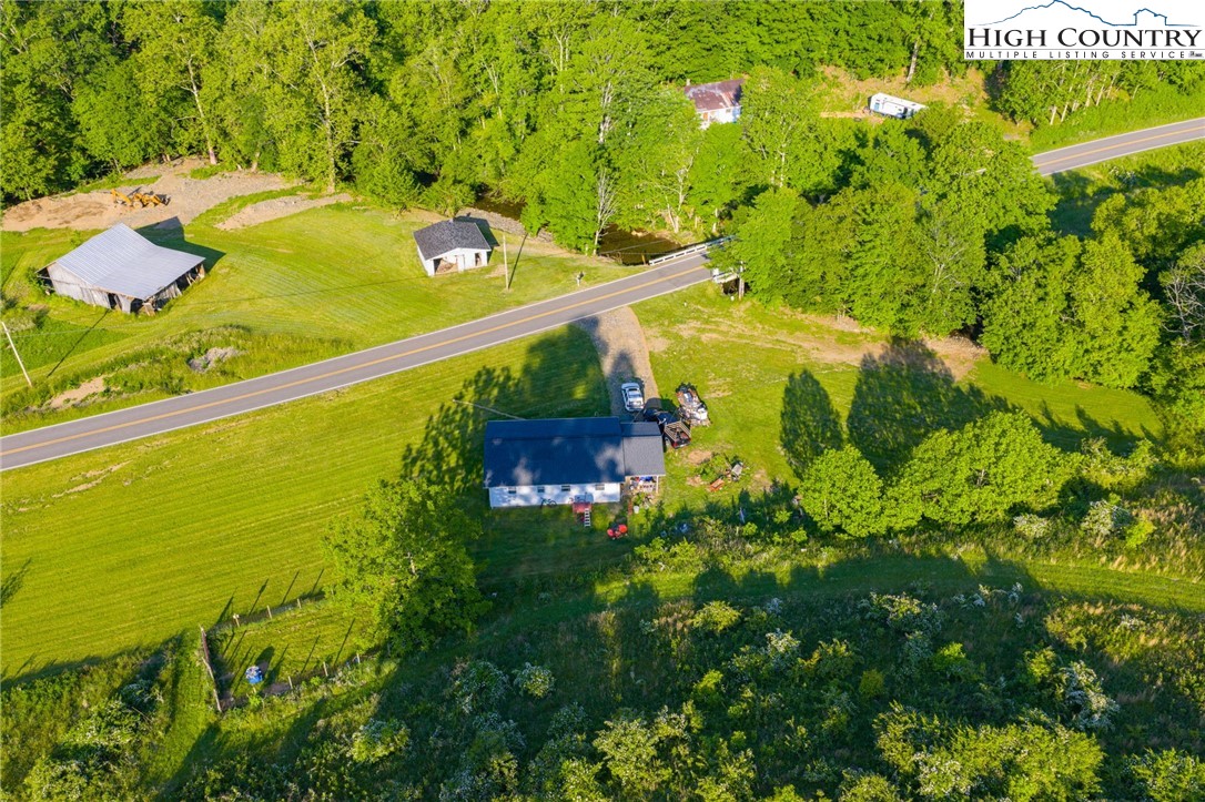 4690 3 Top Road Todd, NC 28684 - Photo 33 of 49 a view of a swimming pool with a yard