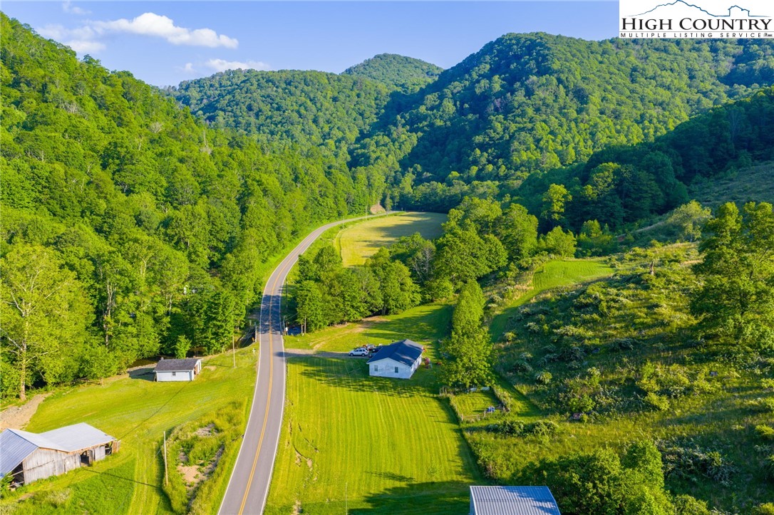 4690 3 Top Road Todd, NC 28684 - Photo 36 of 49 a view of a swimming pool with a yard