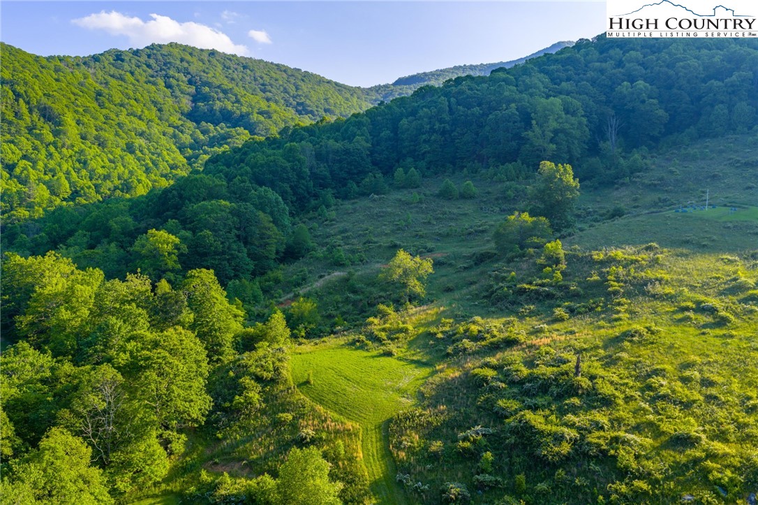 4690 3 Top Road Todd, NC 28684 - Photo 37 of 49 a view of a lake with a mountain in the back