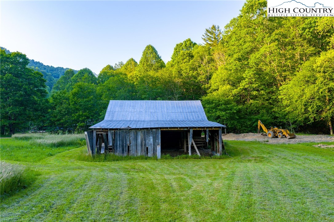 4690 3 Top Road Todd, NC 28684 - Photo 44 of 49 a front view of a house with garden