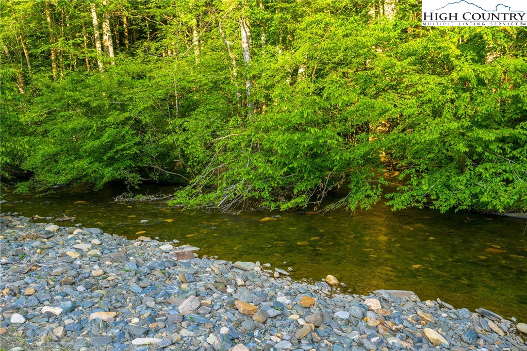 4690 3 Top Road Todd, NC 28684 - Photo 46 of 49 a view of a lake from a yard