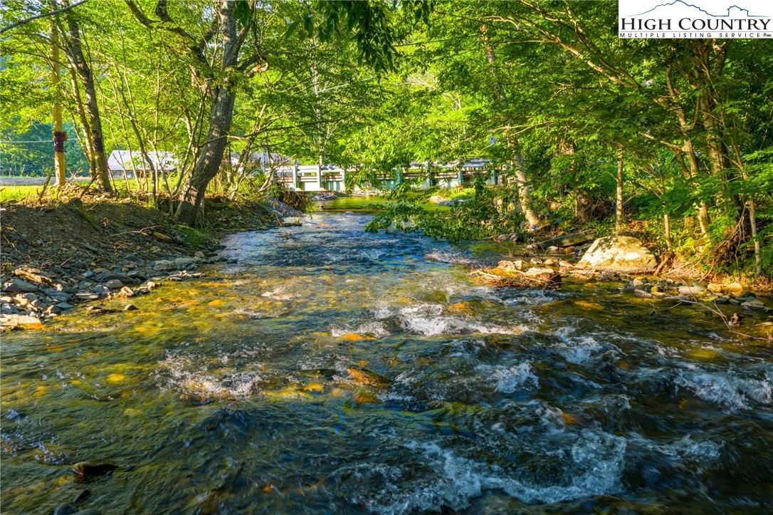 4690 3 Top Road Todd, NC 28684 - Photo 5 of 49 a backyard of a house with lots of green space