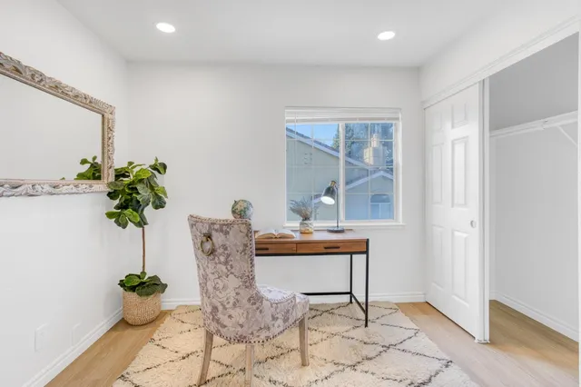 a view of living room with furniture and a potted plant