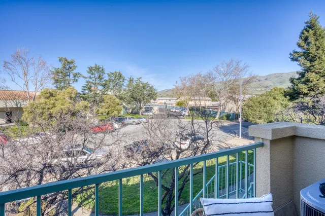 a view of a garden from a balcony