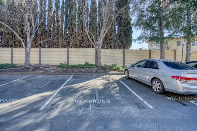 a view of a car parked in front of a house