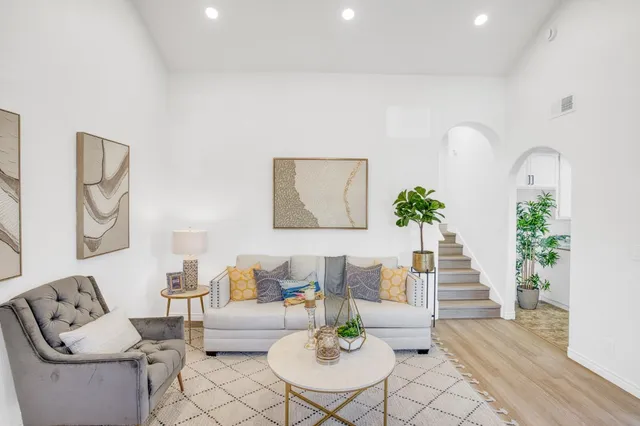 a living room with furniture and a table