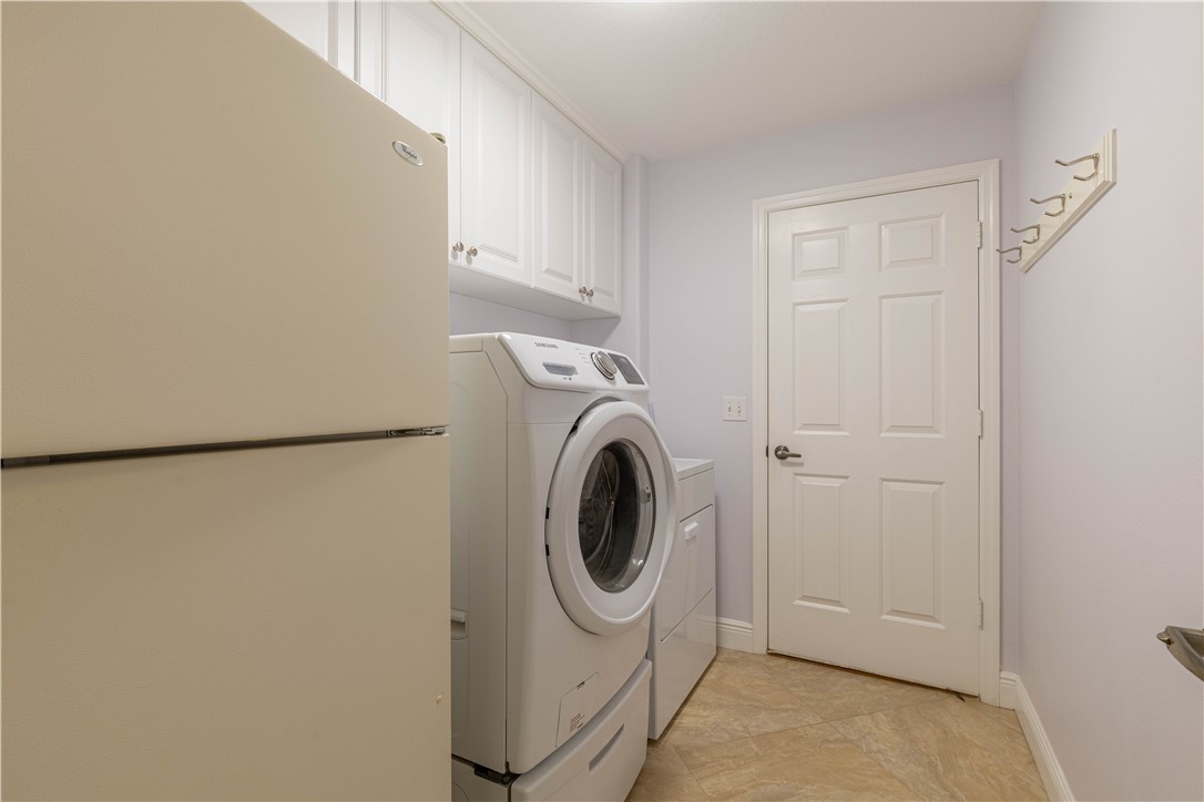 414 Ash Street Sebastian, FL 32958 - Photo 26 of 36 a utility room with dryer and washer