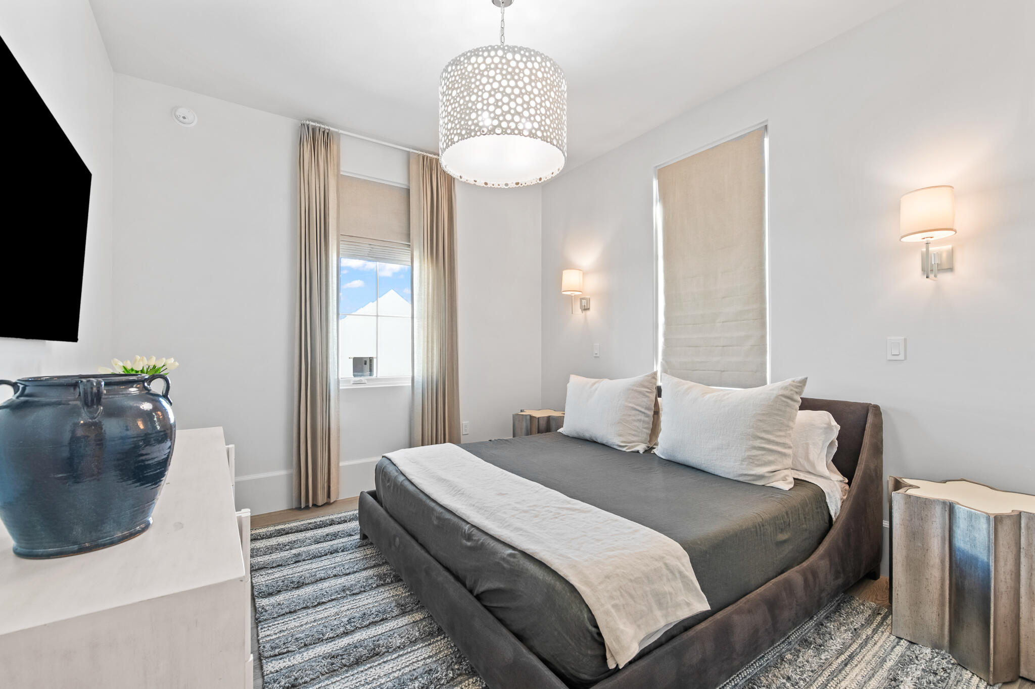 27 Admiralty Row, Unit 201 Inlet Beach, FL 32461 - Photo 21 of 35 a bedroom with a bed and a mirror