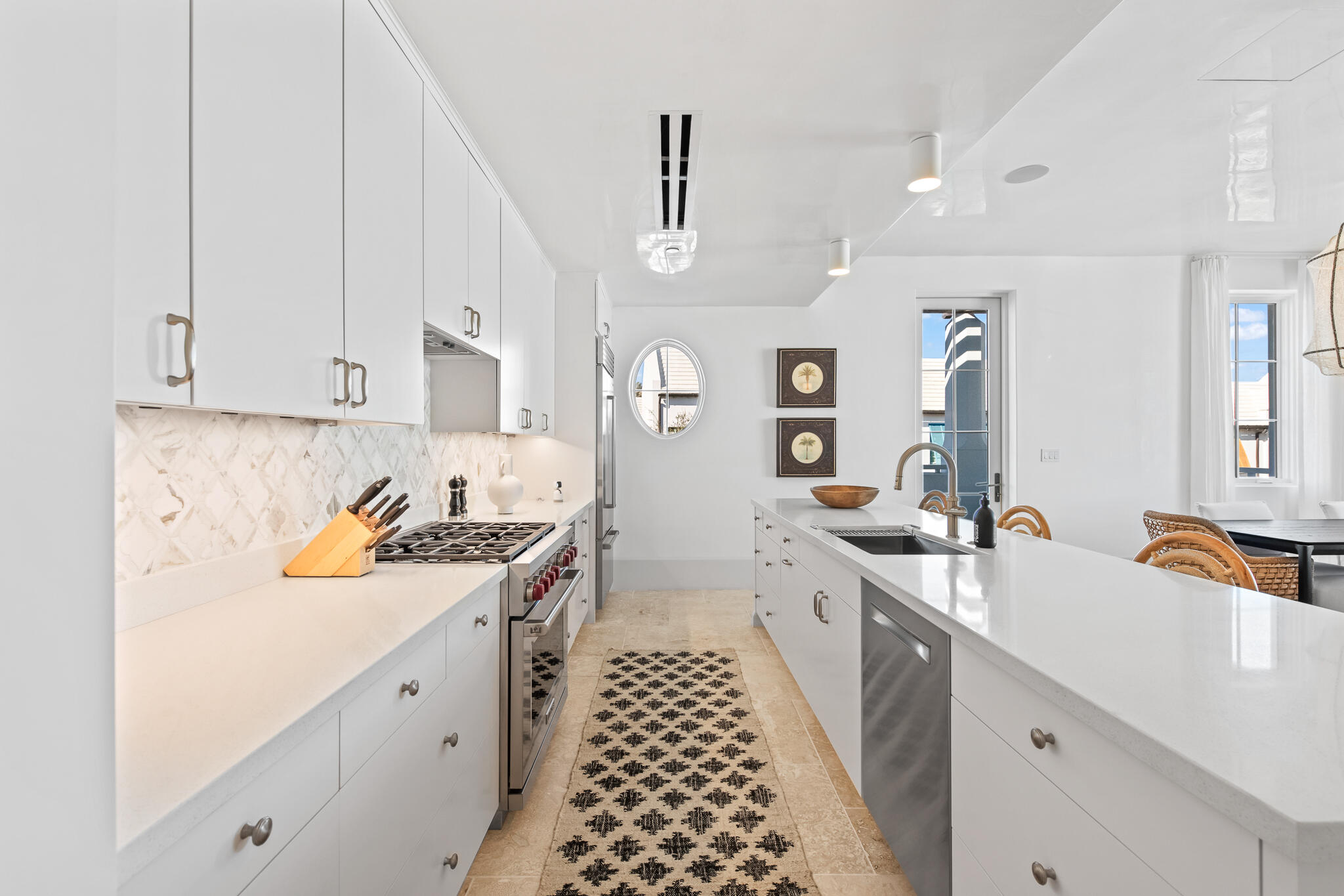 27 Admiralty Row, Unit 201 Inlet Beach, FL 32461 - Photo 5 of 35 a kitchen with stainless steel appliances a white sink and cabinets
