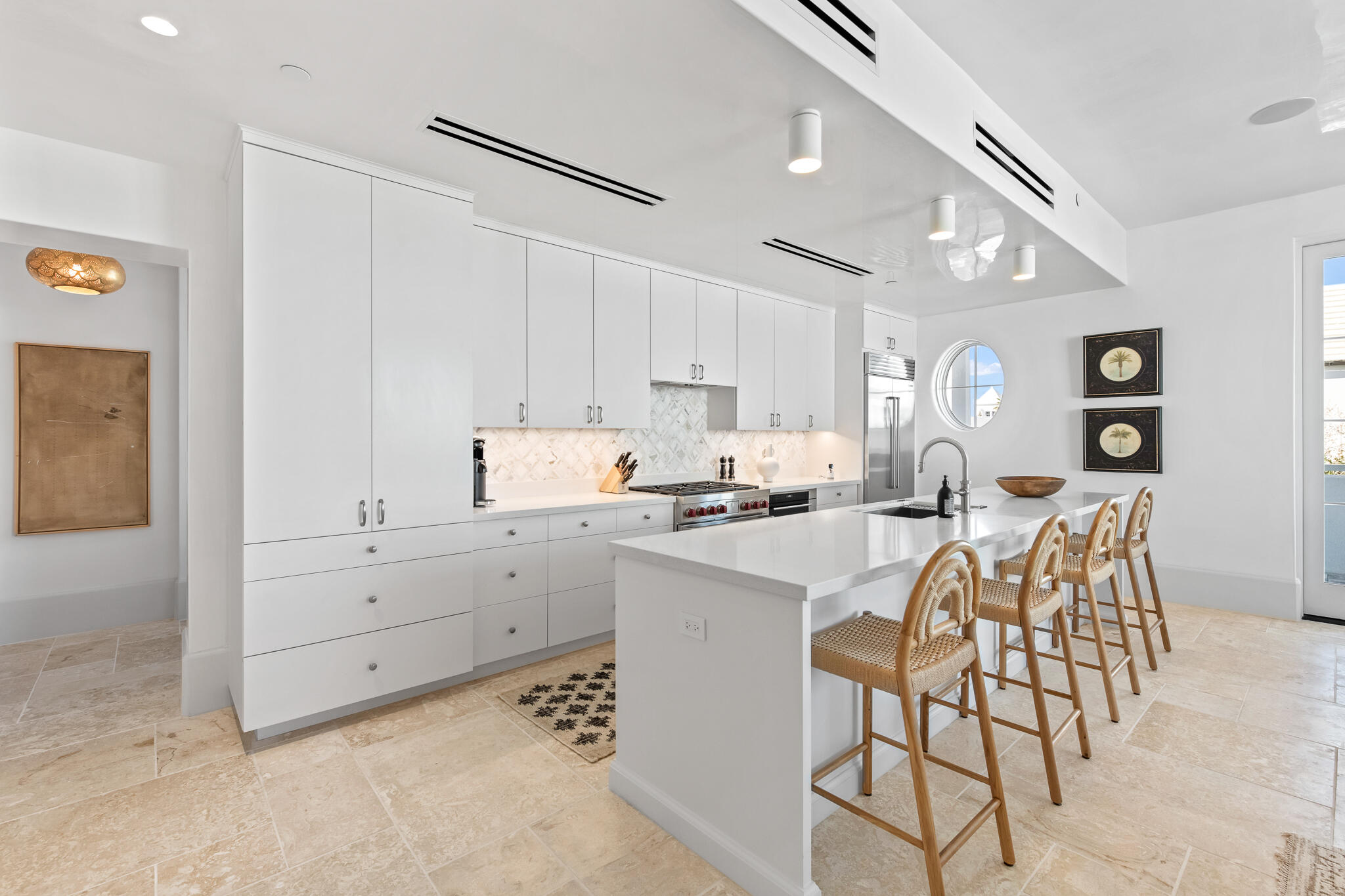 27 Admiralty Row, Unit 201 Inlet Beach, FL 32461 - Photo 6 of 35 a kitchen with white cabinets and appliances