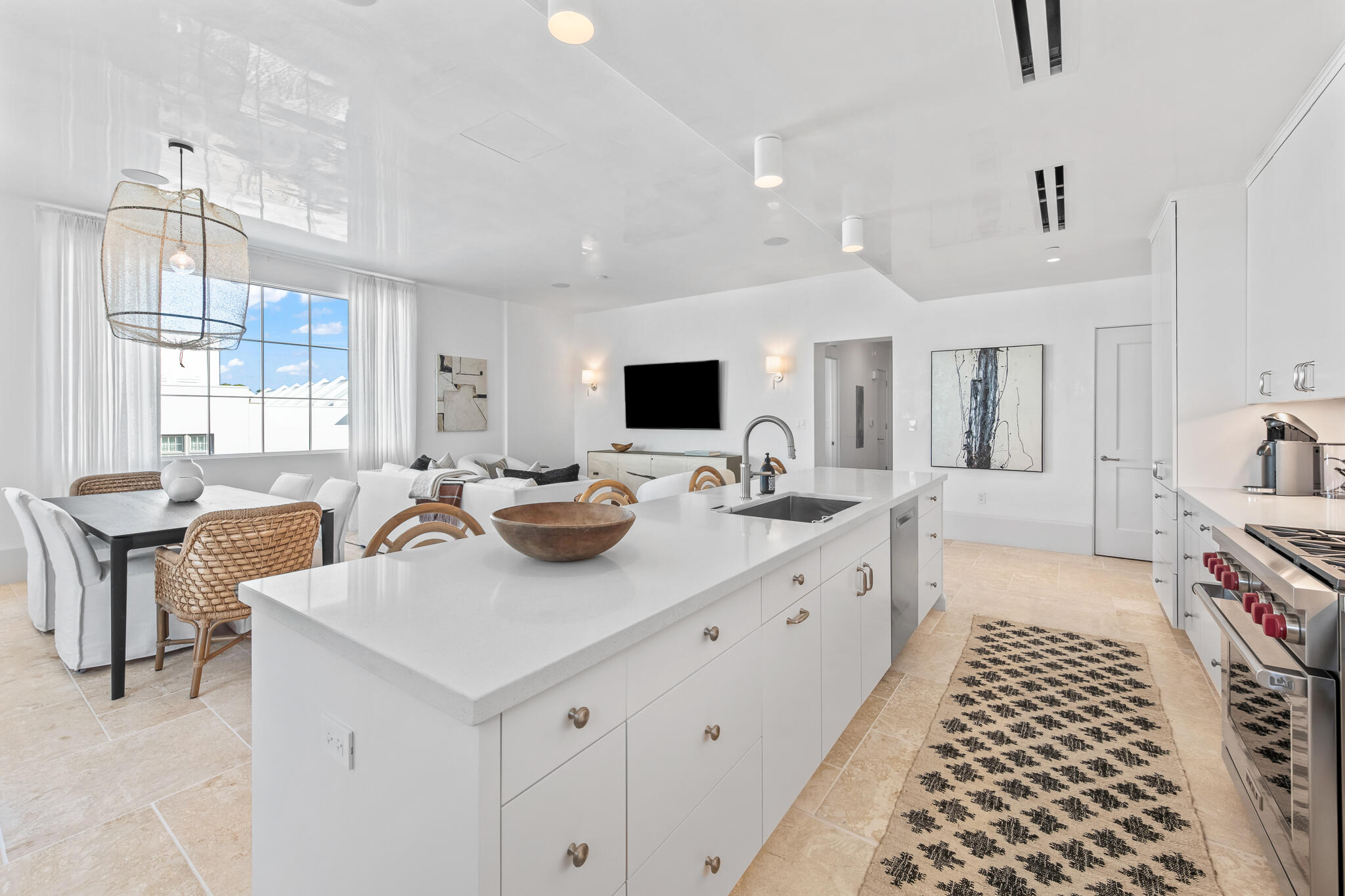 27 Admiralty Row, Unit 201 Inlet Beach, FL 32461 - Photo 8 of 35 a large white kitchen with sink a stove and white cabinets