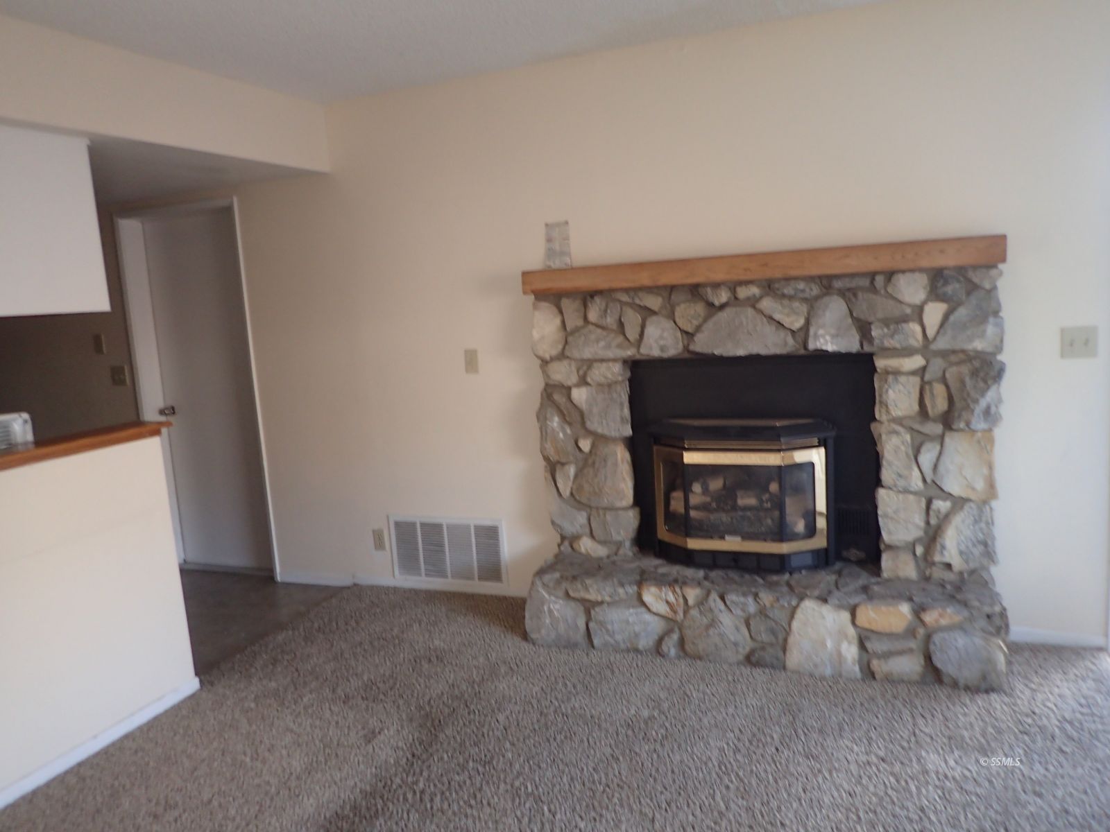 941 West Perdew Avenue Ridgecrest, CA 93555 - Photo 2 of 12 a living room with furniture a fireplace and a flat screen tv