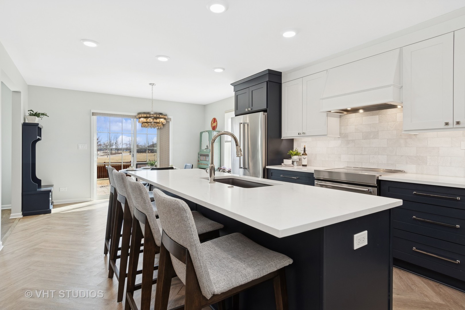 13423 Summergrove Drive Plainfield, IL 60585 - Photo 13 of 37 a kitchen with a table chairs refrigerator and cabinets
