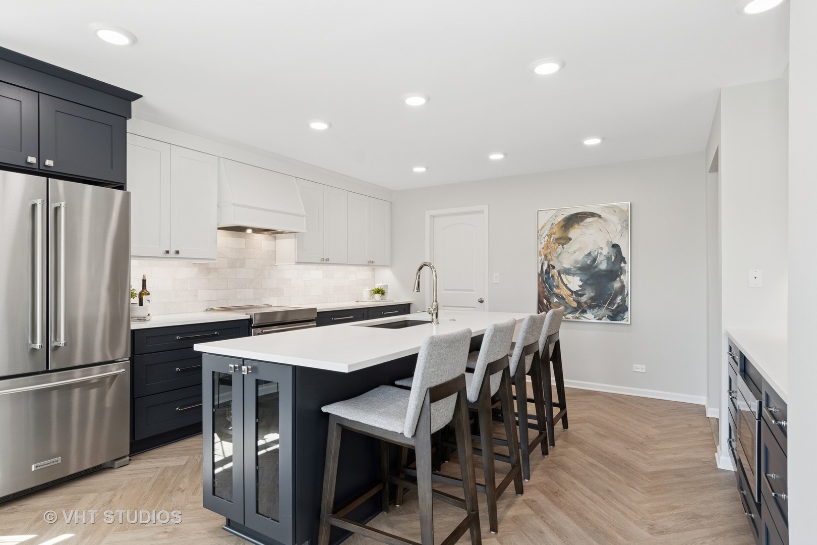 13423 Summergrove Drive Plainfield, IL 60585 - Photo 14 of 37 a kitchen with stainless steel appliances a table chairs refrigerator and microwave
