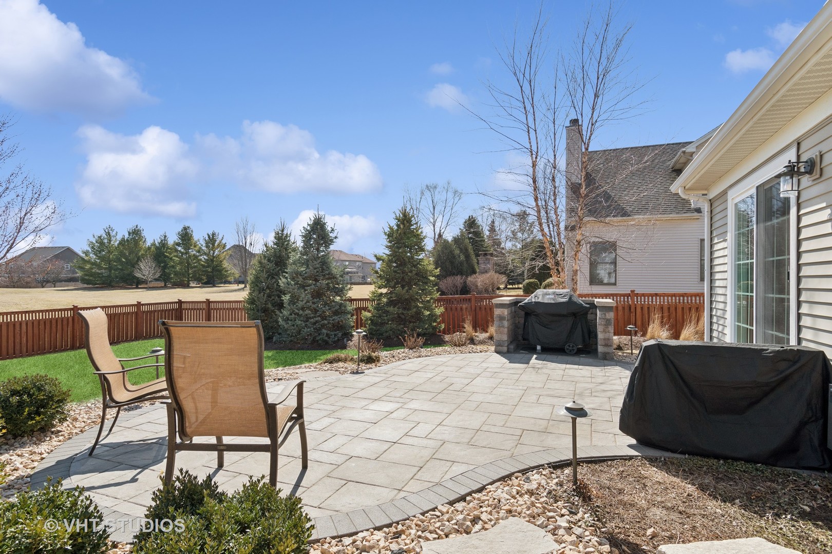 13423 Summergrove Drive Plainfield, IL 60585 - Photo 24 of 37 a view of a terrace with furniture and a fire pit