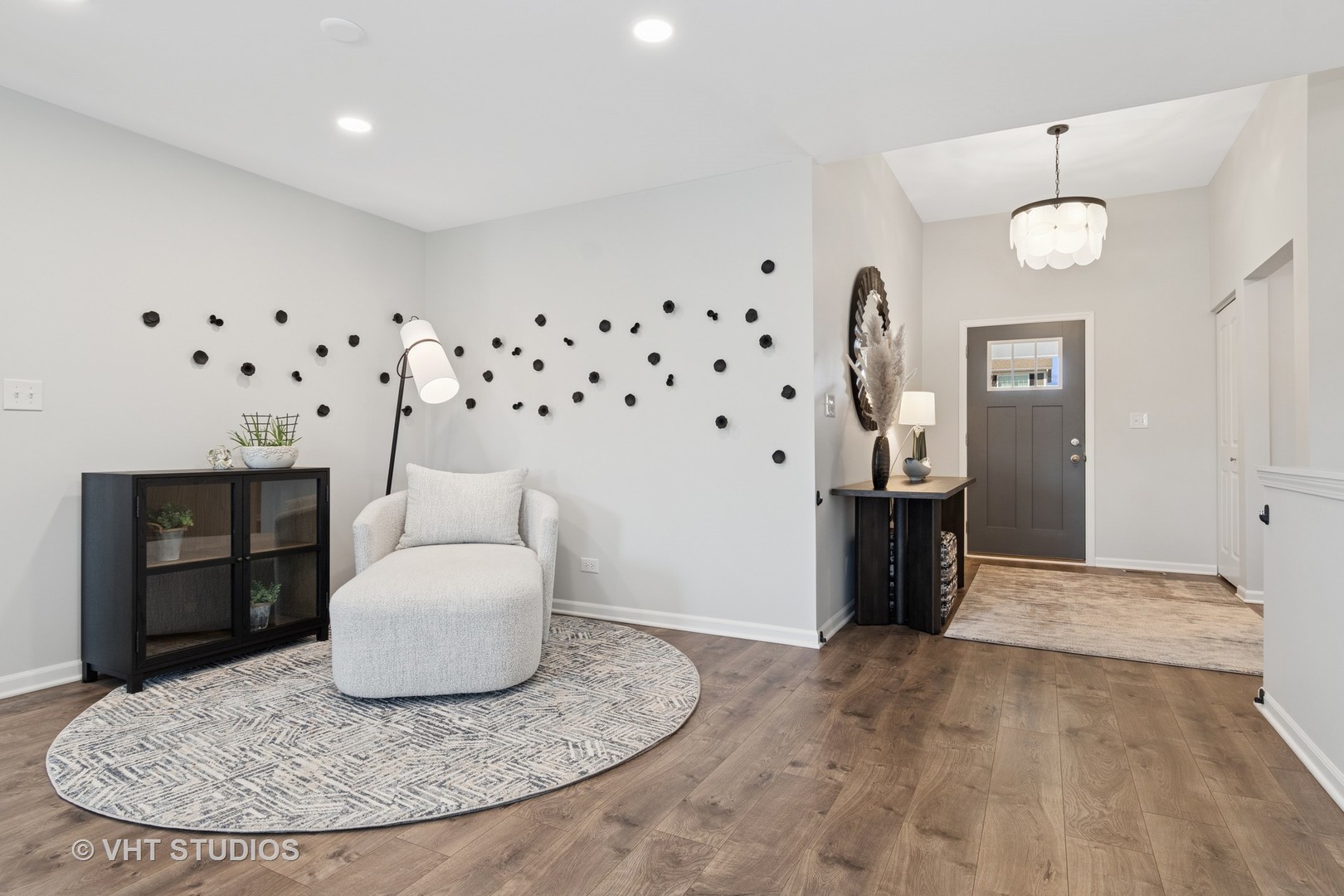 13423 Summergrove Drive Plainfield, IL 60585 - Photo 3 of 37 a view of a livingroom with furniture and chandelier