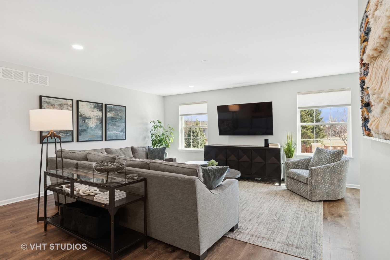 13423 Summergrove Drive Plainfield, IL 60585 - Photo 6 of 37 a living room with furniture and a flat screen tv