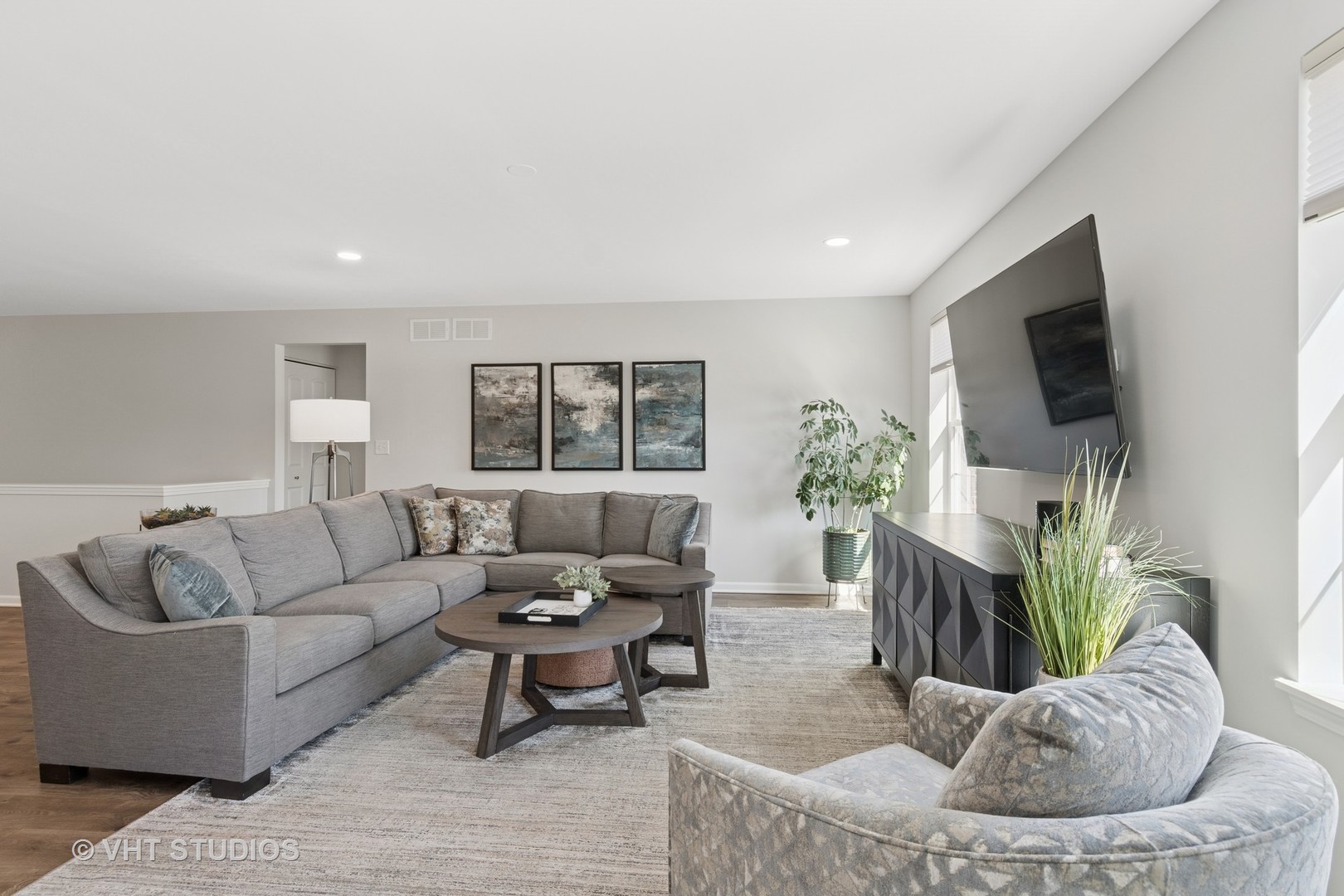 13423 Summergrove Drive Plainfield, IL 60585 - Photo 7 of 37 a living room with furniture and a flat screen tv