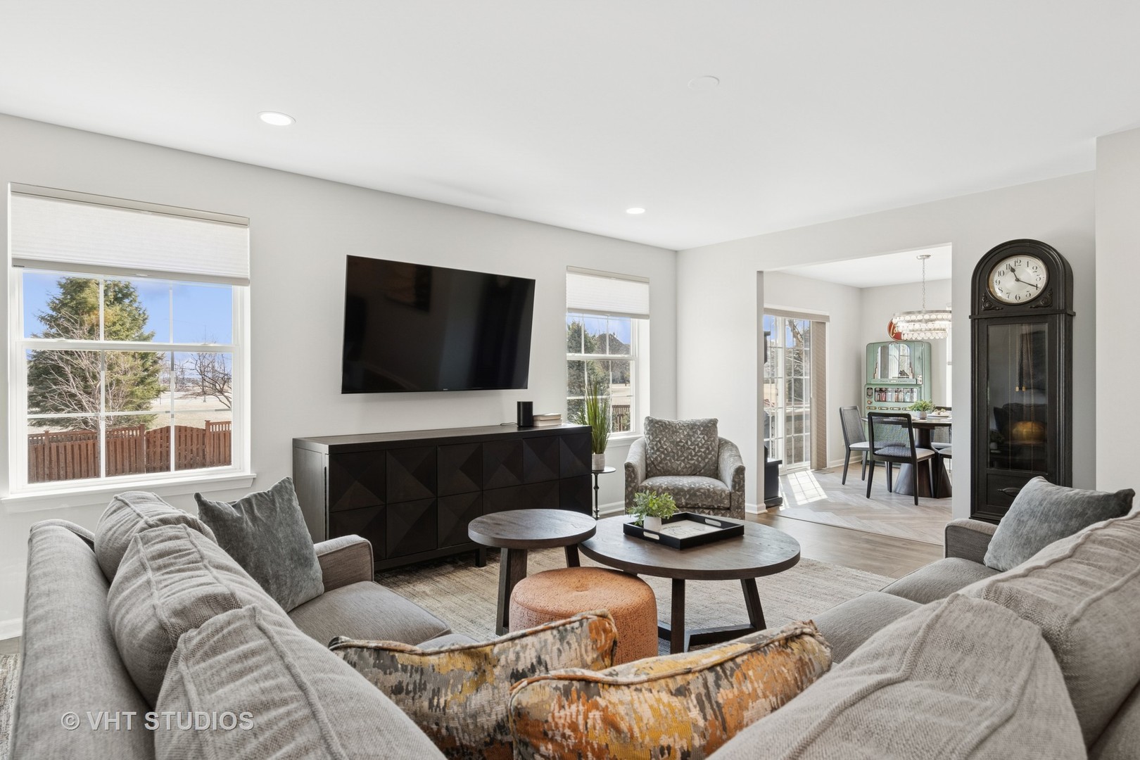 13423 Summergrove Drive Plainfield, IL 60585 - Photo 8 of 37 a living room with furniture and a flat screen tv