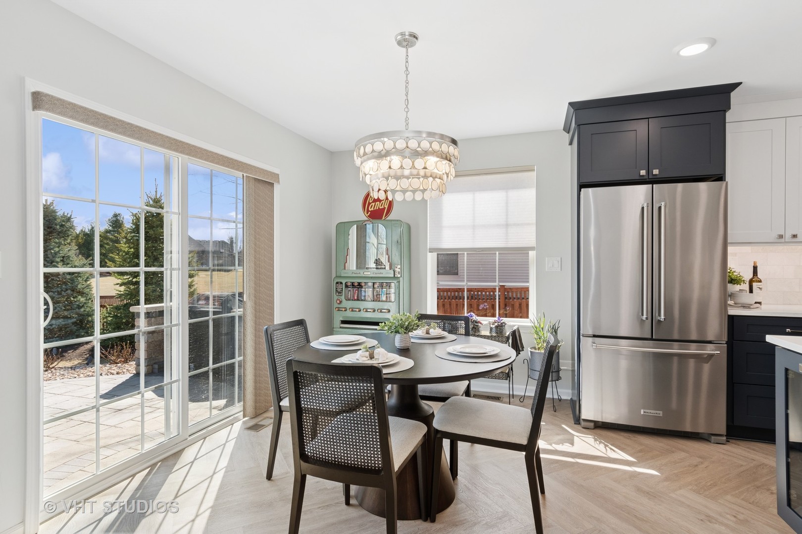 13423 Summergrove Drive Plainfield, IL 60585 - Photo 9 of 37 a dining room with furniture a chandelier and wooden floor